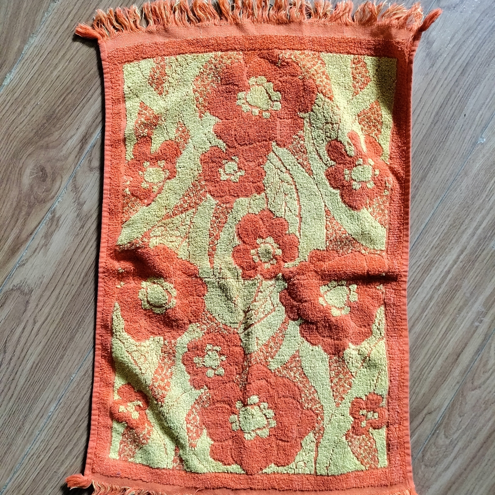 Orange and Cream Bath Towels with Textured Floral Design